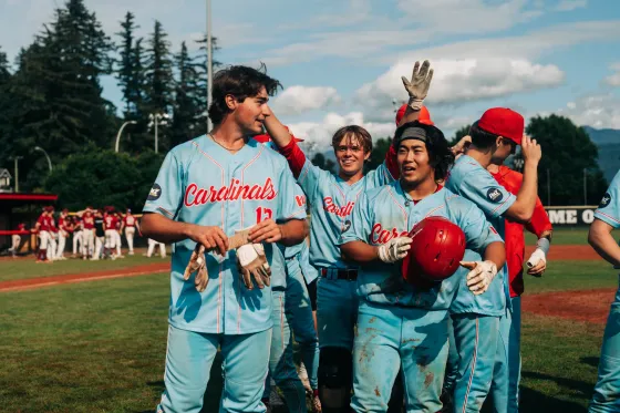 The Abbotsford Cardinals team gathered on the field after the provincial championship win.