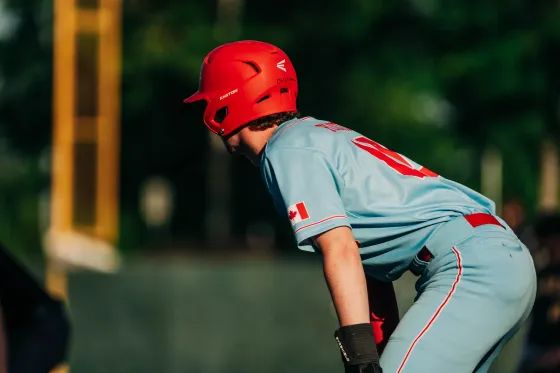An Abbotsford Cardinals baserunner takes his lead off first base in powder blue.